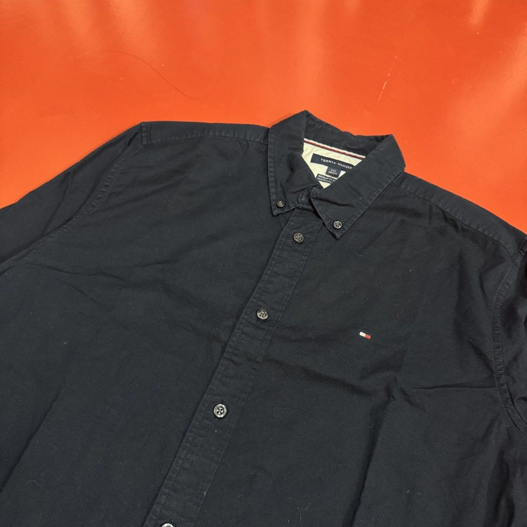 TOMMY HILFIGER BUTTON DOWN LONG SLEEVES POLO (Category: Formal Shirts) located in Pasig City. Submitted by buzzthrifty (Listing ID 1464885821, Image 2). Description: SIZE L-XL 22x30 EXCELLENT CONDITION .