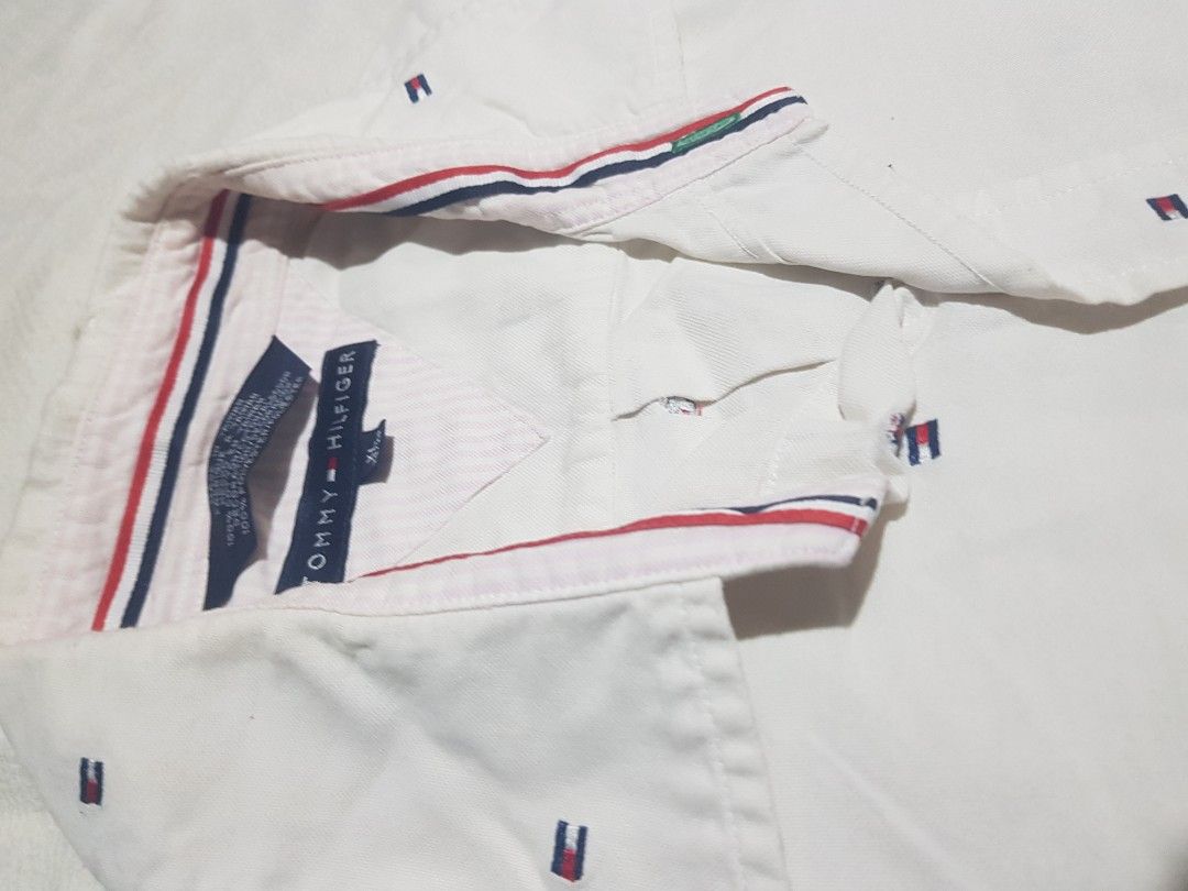 Tommy Hilfiger white polo (Category: Formal Shirts) located in Manila. Submitted by arttchive (Listing ID 1464924738, Image 2). Description: Tommy Hilfiger white polo XL on tag Length: 21 Sleeve: 10 Width: 25.5 Issue: mini holes Color rate: 9/10 Excellent condition ₱349.00+shipp Available✅.