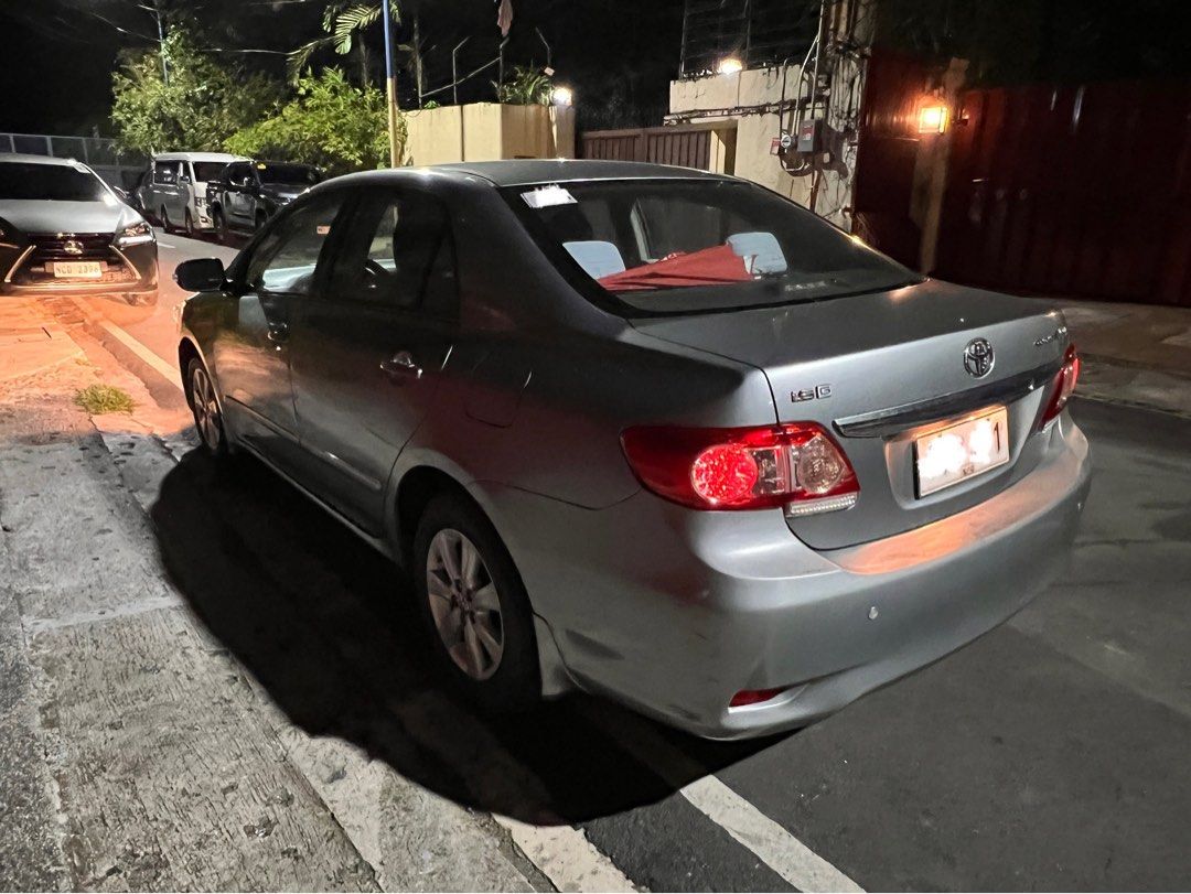 Toyota Corolla Altis 1.6 (A) (Category: Used Cars) located in Mandaluyong City. Submitted by jayborino (Listing ID 1464875550, Image 2). Description: 2011 Toyota Corolla Altis 1.6G Automatic — ₱300,000 (As-is, where-is) • 1st owner, well-kept personal vehicle • 76,000 km / ~5,000 km/year • Silver, automatic, no mods • Smooth, solid engine & comfortable drive • Clean original OR/CR on hand • Registration updated for 2026 • Plate ending 1 (Monday c