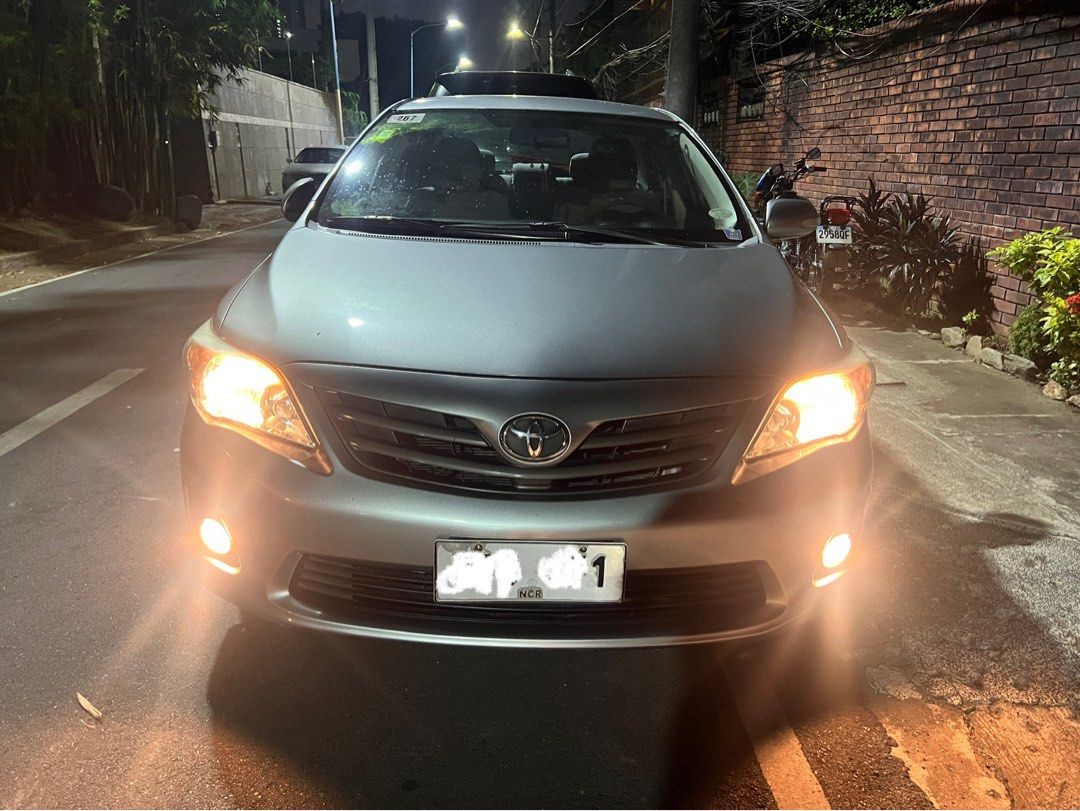 Toyota Corolla Altis 1.6 (A) (Category: Used Cars) located in Mandaluyong City. Submitted by jayborino (Listing ID 1464875550, Image 3). Description: 2011 Toyota Corolla Altis 1.6G Automatic — ₱300,000 (As-is, where-is) • 1st owner, well-kept personal vehicle • 76,000 km / ~5,000 km/year • Silver, automatic, no mods • Smooth, solid engine & comfortable drive • Clean original OR/CR on hand • Registration updated for 2026 • Plate ending 1 (Monday c
