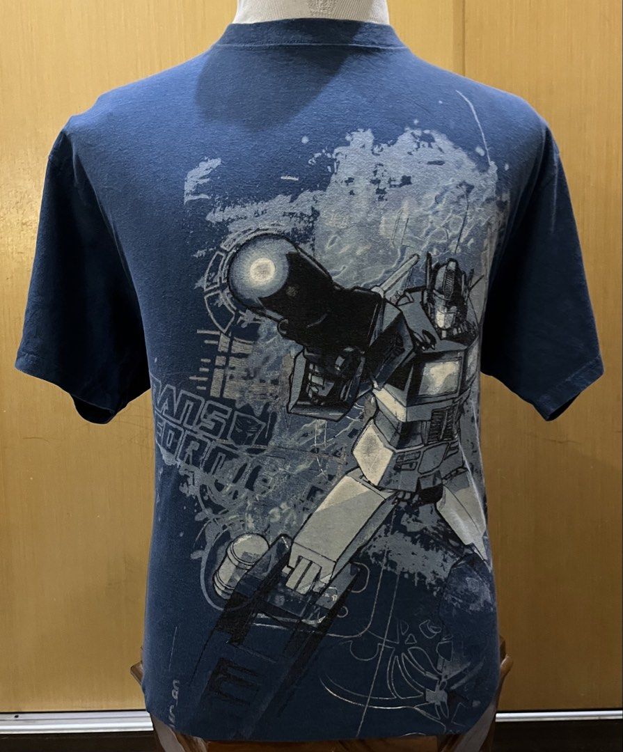 TRANSFORMERS (Category: Tshirts & Polo Shirts) located in Seremban. Submitted by imagurlilu (Listing ID 1464775556, Image 2). Description: ♥️TRANSFORMERS♥️ 🖤Size : Pit:22.5” / Lenght :28.5” 🖤 Tag : PRINTED GIANT ( Tag size L) 🖤 Made in : MEXICO 🖤 Fabric : 💯COTTON 🖤 Color : BLUE 🖤Stitch : DOUBLE ⬆️⬇️ 🖤 SIDEBONE : NO 🖤 Condition : 9/10 🖤 Defect / hole : ❌ 🖤 Graphic : STILL LOOK GOOD 🖤 Copyright / Trademark : 🚗 : COD SEREMBAN2 📝 : COLO