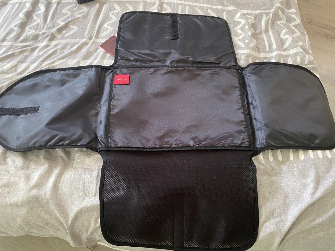 Travel Organizer and bdo envelope (Category: Sling Bags) located in Santa Rosa. Submitted by hoardqueensdeclutter (Listing ID 1464962067, Image 3). Description: - Brand: Traveller Essentials - Color: Black - Condition: Brand new with original tags from Rustan's - Design: Folds out completely flat for effortless packing - Storage: Multiple internal compartments and breathable mesh sections - Portability: Features a sturdy top handle for easy carry