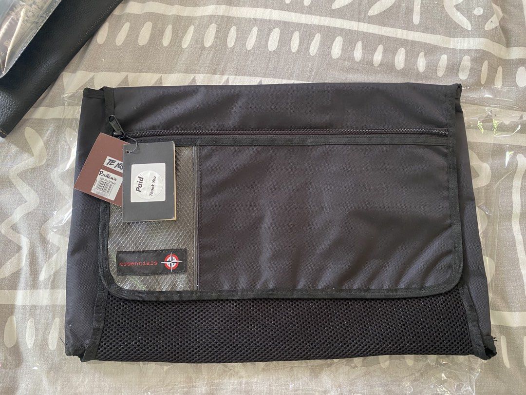 Travel Organizer and bdo envelope (Category: Sling Bags) located in Santa Rosa. Submitted by hoardqueensdeclutter (Listing ID 1464962067, Image 2). Description: - Brand: Traveller Essentials - Color: Black - Condition: Brand new with original tags from Rustan's - Design: Folds out completely flat for effortless packing - Storage: Multiple internal compartments and breathable mesh sections - Portability: Features a sturdy top handle for easy carry
