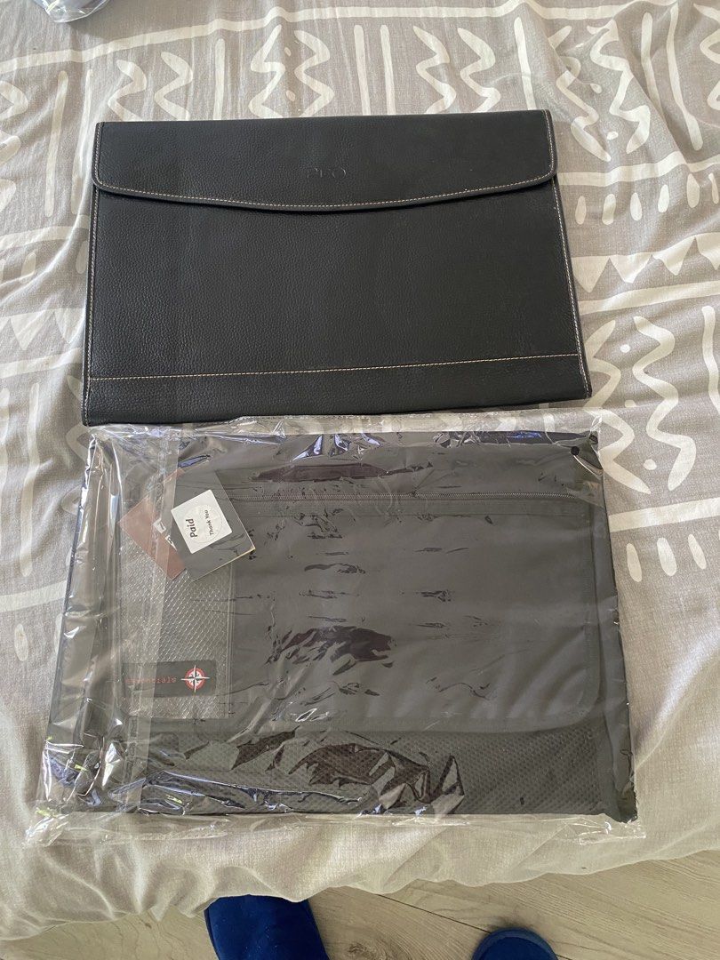 Travel Organizer and bdo envelope (Category: Sling Bags) located in Santa Rosa. Submitted by hoardqueensdeclutter (Listing ID 1464962067, Image 1). Description: - Brand: Traveller Essentials - Color: Black - Condition: Brand new with original tags from Rustan's - Design: Folds out completely flat for effortless packing - Storage: Multiple internal compartments and breathable mesh sections - Portability: Features a sturdy top handle for easy carry
