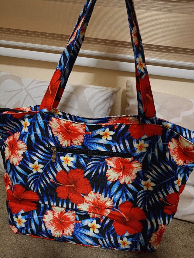 Tropical Floral Canvas Tote Bag (Category: Tote Bags) located in Valenzuela. Submitted by One.Only.Nan (Listing ID 1464923217, Image 3). Description: Get ready for your next vacation or beach day with this beautiful, brand-new Hawaii Tropical Floral Beach Tote Bag. It features a vibrant, colorful hibiscus print with a bold "HAWAII" text block across the front. Perfect for the pool, beach, cruises, or everyday summer shopping! • Condition: Brand N