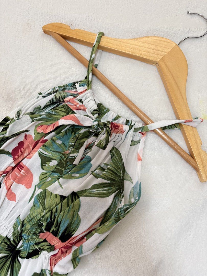 Tropical Leaf Print Halter Dress (Category: Babies & Kids Fashion) located in Cabuyao City. Submitted by mhd.i (Listing ID 1464968008, Image 2). Description: - 2-3y Tropical print dress with green leaves and pink floral accents on a white background. Halter neckline ties in a bow at the front. Elastic waistband creates a gathered fit through the middle. Lightweight fabric, great warm-weather outfit. Short length, very easy to throw on for vacatio