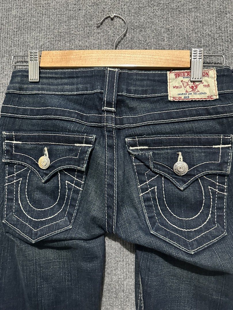 True Religion Julie Section Jeans Size 24 (Category: Jeans) located in Villasis. Submitted by justinramosonfb (Listing ID 1464871778, Image 1). Description: - Brand: True Religion - Style: Dark wash denim with iconic white contrast stitching - Details: Signature button flap back pockets with horseshoe design, front button and zipper closure - Origin: Made in USA - Size: 24 - Condition: Excellent pre-loved condition.