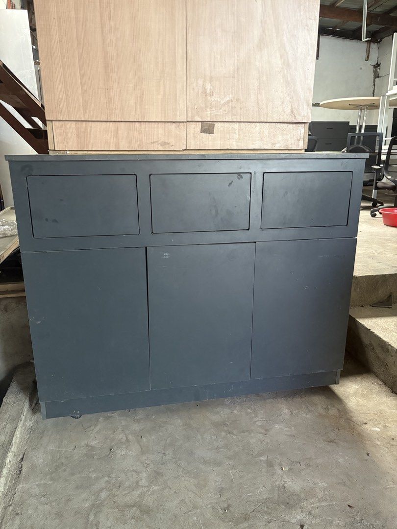 Two-tier wooden waste bin (Category: Waste Bins & Bags) located in Valenzuela. Submitted by cha_leng.861 (Listing ID 1464839718, Image 2). Description: - Product: Heavy-duty combination storage cabinet - Upper Section: Natural wood grain finish with double doors and recessed panels - Lower Section: Dark grey cabinet featuring 3 top drawers and 3 lower doors - Design: Sturdy, stackable, and built for heavy use - Best For: Office, workshop, or gara
