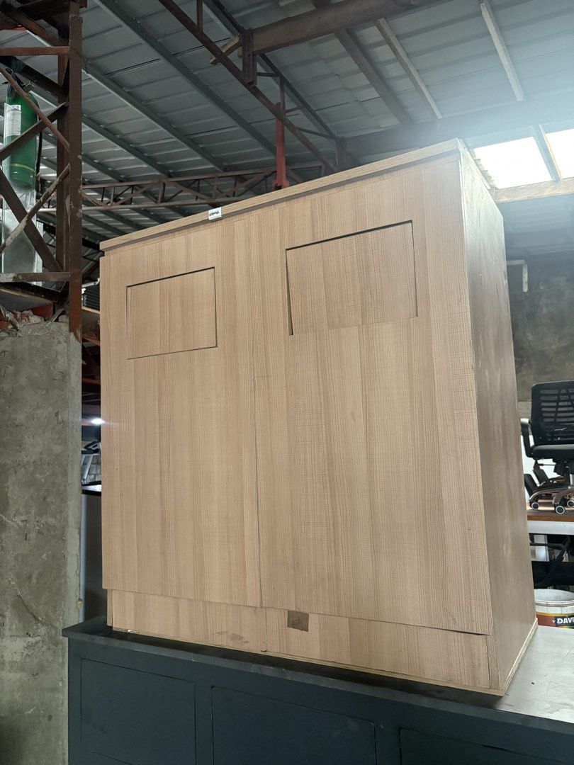 Two-tier wooden waste bin (Category: Waste Bins & Bags) located in Valenzuela. Submitted by cha_leng.861 (Listing ID 1464839718, Image 1). Description: - Product: Heavy-duty combination storage cabinet - Upper Section: Natural wood grain finish with double doors and recessed panels - Lower Section: Dark grey cabinet featuring 3 top drawers and 3 lower doors - Design: Sturdy, stackable, and built for heavy use - Best For: Office, workshop, or gara