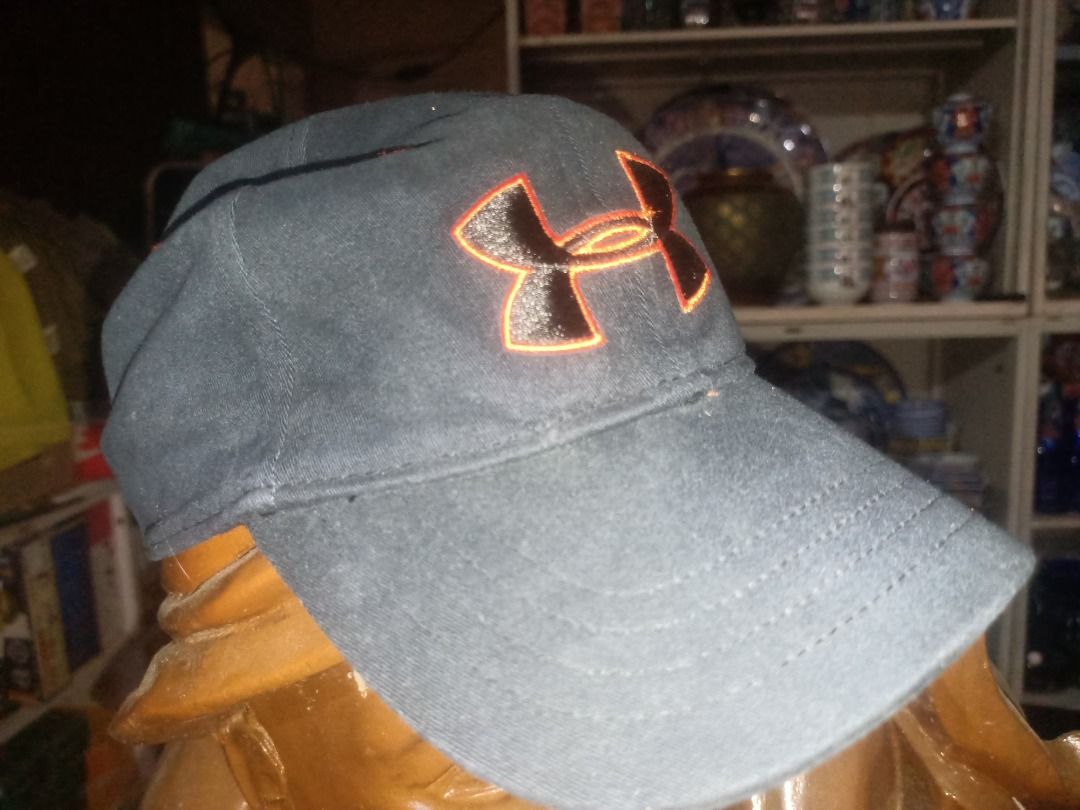 Under Armour Youth Cap Black Orange Logo (Category: Caps & Hats) located in Munoz. Submitted by larryc1212 (Listing ID 1464900529, Image 1). Description: - Brand: Under Armour - Color: Black with orange embroidered logo - Size: Youth Small/Medium - Material: Cotton and spandex blend for comfort and stretch - Fit: Structured fit with a curved brim - Details: Inner taped seams with printed Under Armour branding - Style Number: 1244660 (Spring 2014 
