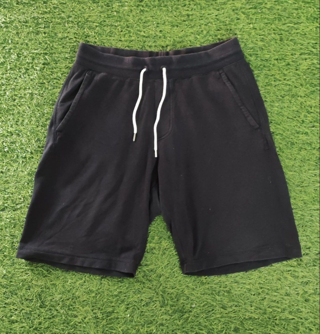 Uniqlo Black Sweat Shorts with Drawstring (Category: Shorts) located in Makati City. Submitted by rare_thrift_stuff (Listing ID 1464825465, Image 1). Description: - Authentic Uniqlo black sweat shorts - Comfortable cotton, polyester, and spandex blend - Elastic waistband with contrast white drawstring cords - Convenient dual side pockets - Standard fit, ideal for casual wear, lounging, or running errands - Versatile design that pairs easily with 