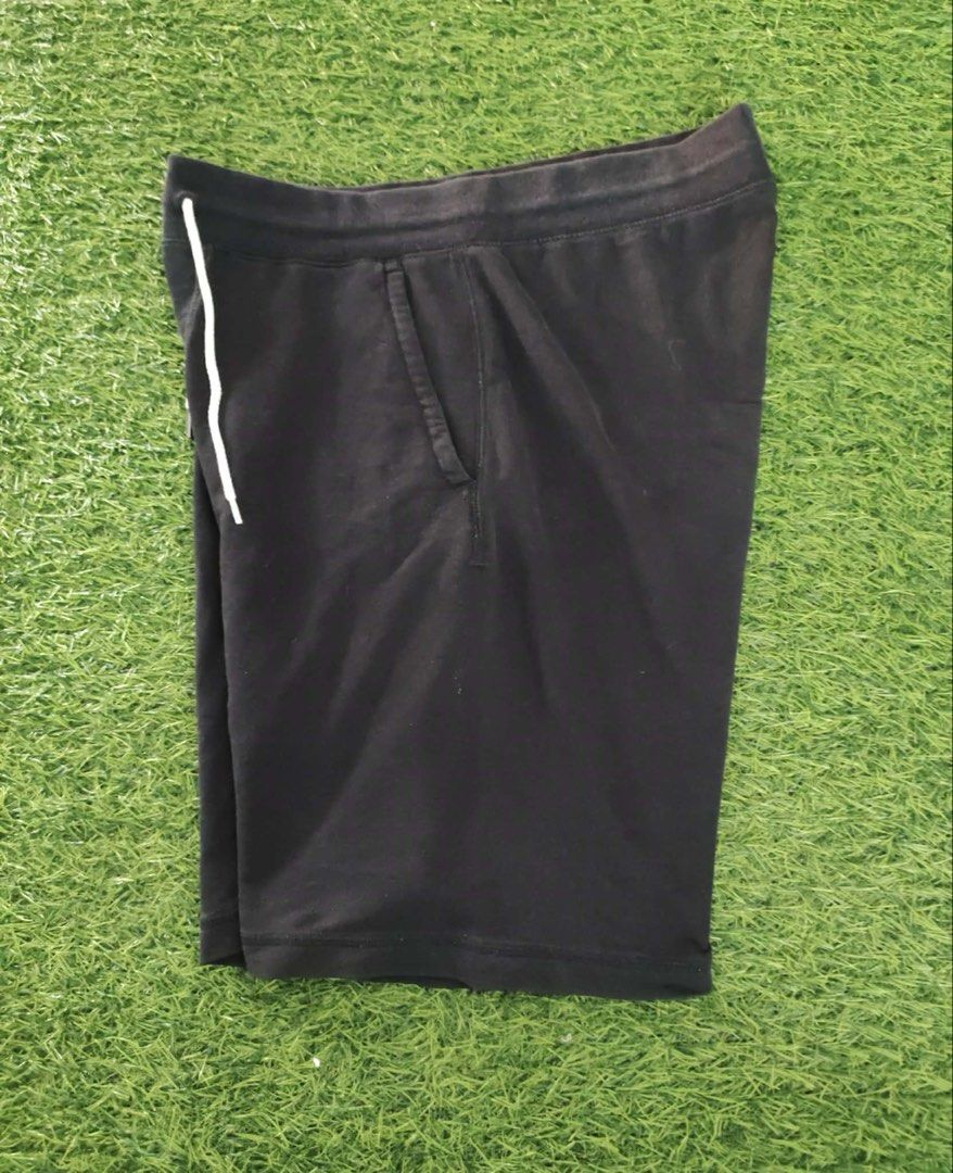 Uniqlo Black Sweat Shorts with Drawstring (Category: Shorts) located in Makati City. Submitted by rare_thrift_stuff (Listing ID 1464825465, Image 2). Description: - Authentic Uniqlo black sweat shorts - Comfortable cotton, polyester, and spandex blend - Elastic waistband with contrast white drawstring cords - Convenient dual side pockets - Standard fit, ideal for casual wear, lounging, or running errands - Versatile design that pairs easily with 