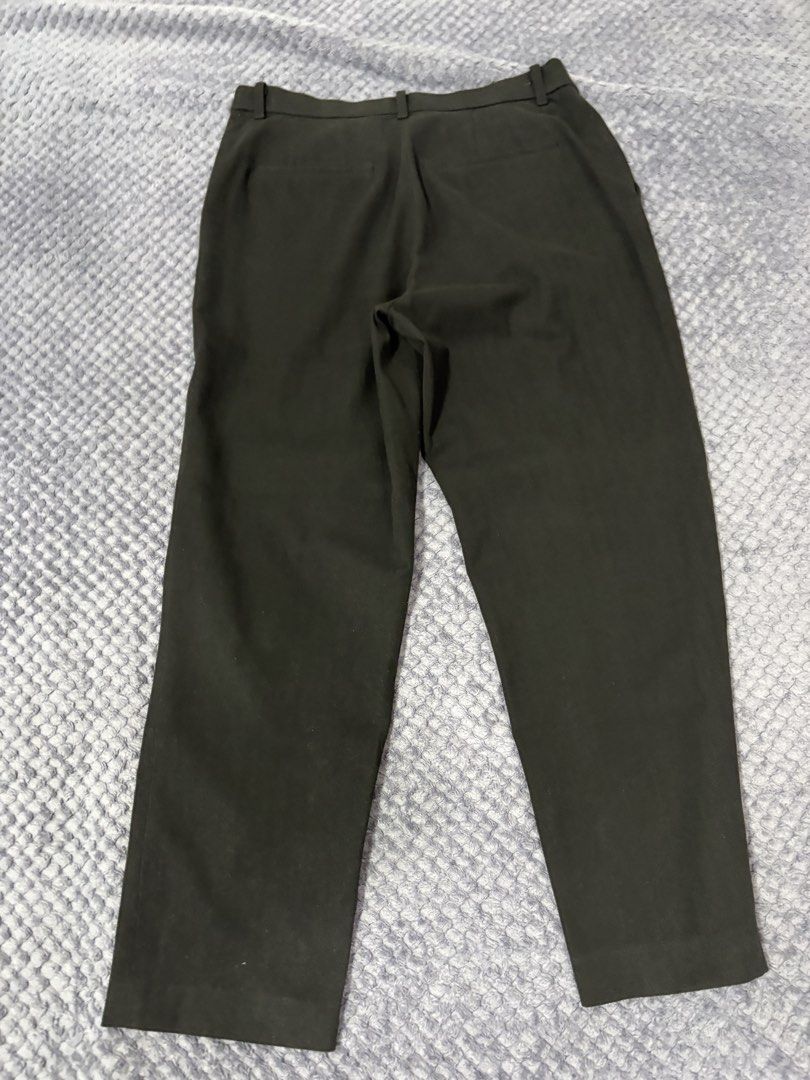 Uniqlo Black Trousers Pants Size L (Category: Other Bottoms) located in Manila. Submitted by luckystone_0cdaee (Listing ID 1464948021, Image 3). Description: - Brand: Uniqlo - Item: Classic Black Trousers - Size: L (Waist: 69-75cm | Hips: 94-100cm) - Material: 66% polyester, 30% rayon, 4% spandex (with slight stretch for all-day comfort) - Design: Straight cut, belt loops, and secure button closure - Condition/Vibe: Great basic piece, highly vers