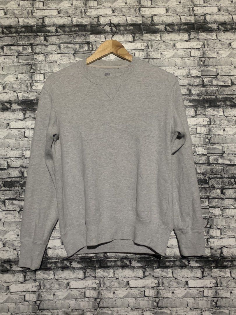 Uniqlo Grey Crew Neck Sweatshirt (Category: Coats, Jackets and Outerwear) located in Manila. Submitted by marksaban81396 (Listing ID 1464957229, Image 3). Description: Size small Width 20 Lenght 24.5 Color rate 9.5/10 No issue Excellent condition - Brand/Style: Uniqlo Grey Cotton Sweatshirt - Design: Classic crew neck with v-stitch detail - Fit: Ribbed cuffs and hem for a snug fit - Versatility: Great for layering or casual daily wear - Matching: