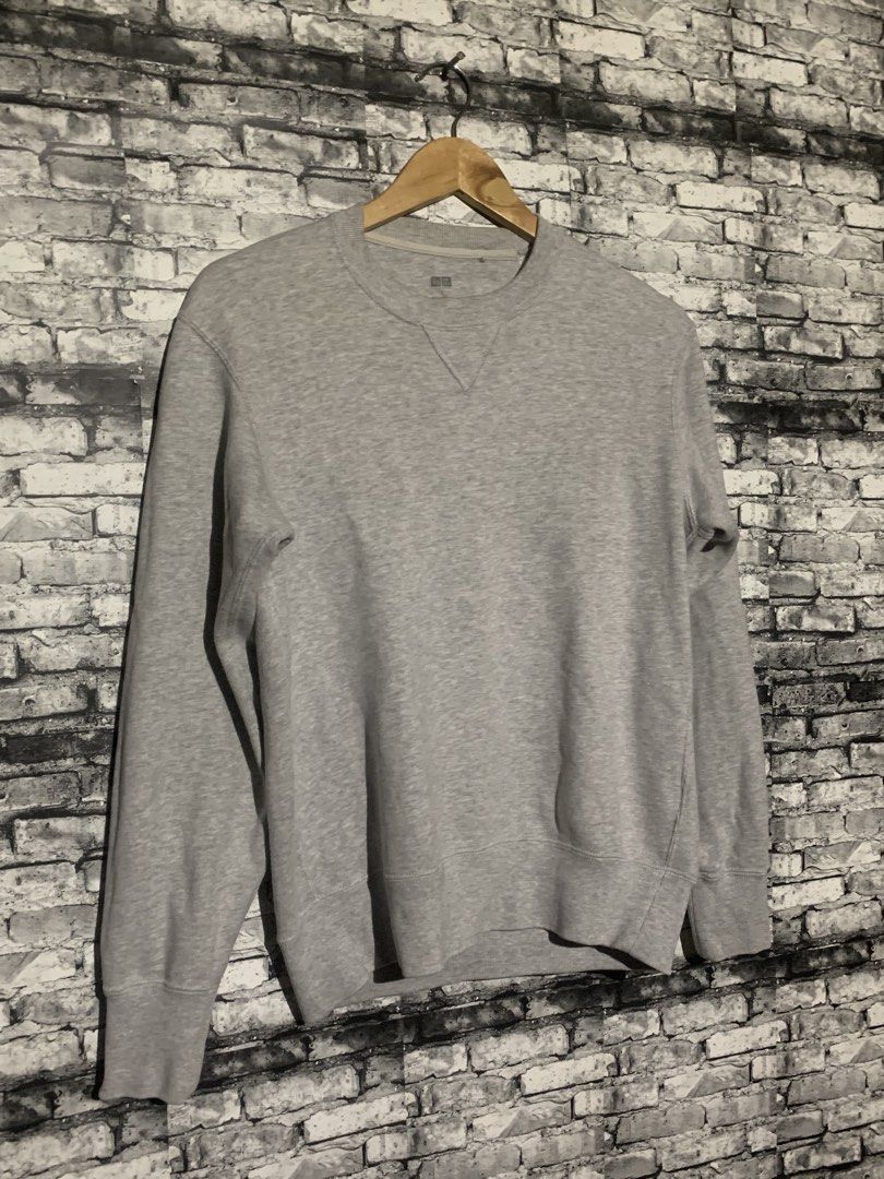 Uniqlo Grey Crew Neck Sweatshirt (Category: Coats, Jackets and Outerwear) located in Manila. Submitted by marksaban81396 (Listing ID 1464957229, Image 2). Description: Size small Width 20 Lenght 24.5 Color rate 9.5/10 No issue Excellent condition - Brand/Style: Uniqlo Grey Cotton Sweatshirt - Design: Classic crew neck with v-stitch detail - Fit: Ribbed cuffs and hem for a snug fit - Versatility: Great for layering or casual daily wear - Matching: