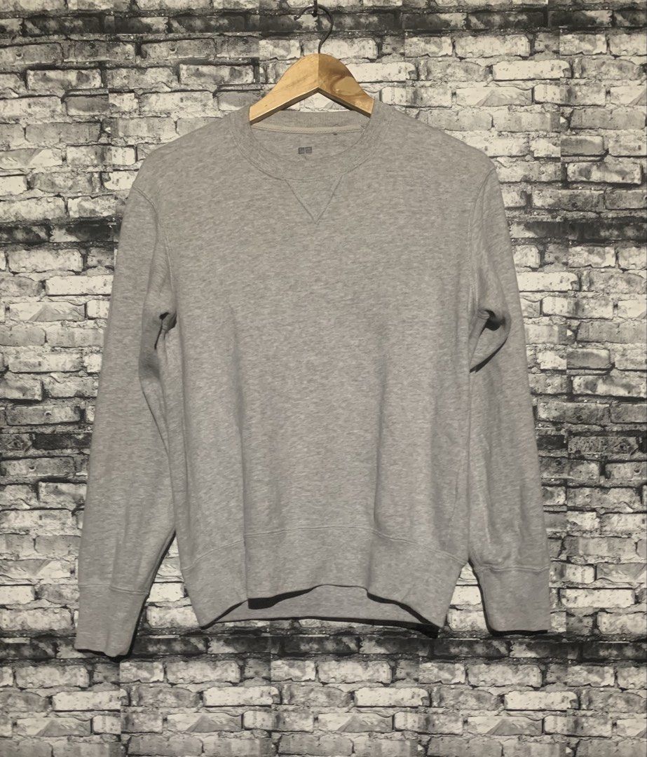 Uniqlo Grey Crew Neck Sweatshirt (Category: Coats, Jackets and Outerwear) located in Manila. Submitted by marksaban81396 (Listing ID 1464957229, Image 1). Description: Size small Width 20 Lenght 24.5 Color rate 9.5/10 No issue Excellent condition - Brand/Style: Uniqlo Grey Cotton Sweatshirt - Design: Classic crew neck with v-stitch detail - Fit: Ribbed cuffs and hem for a snug fit - Versatility: Great for layering or casual daily wear - Matching: