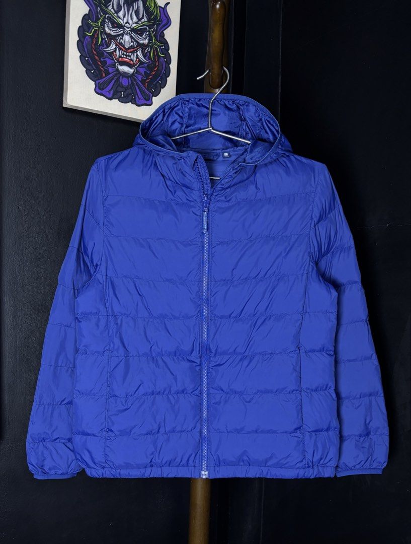 Uniqlo Blue Hooded Puffer Jacket (Category: Coats, Jackets and Outerwear) located in Bacoor. Submitted by calvinmanzano13 (Listing ID 1464828481, Image 1). Description: - L = 22” | W = 19” - Can also fit to women - Closure: Full zip with pull tab - Design: Warm quilted pattern with lightweight feel - Safety feature: Reflective dots on lower back Notes: ☑️ Hand washed ☑️ Polished ☑️ Steam ironed.