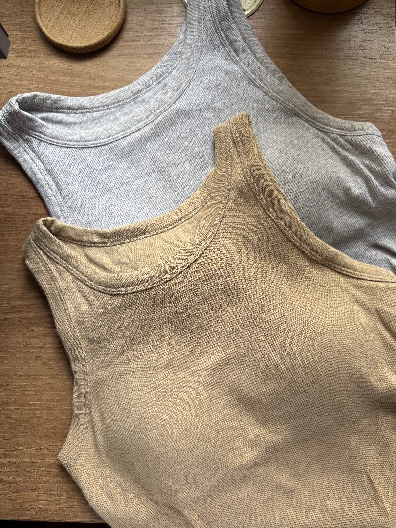 Uniqlo Ribbed Cropped Bra Top (Category: Sleeveless) located in Rizal. Submitted by yowfaveariesdeclutter (Listing ID 1464832515, Image 1). Description: - Brand: Uniqlo - Item: Ribbed Cropped Bra Top Bundle (Set of 2) - Colors: Beige and Grey - Features: Built-in cups, stretchy and comfortable fabric - Style: Great everyday basic, perfect with high-waisted jeans or cargos - Condition: Excellent RFS: decluttering and change of style 899 bundle 500