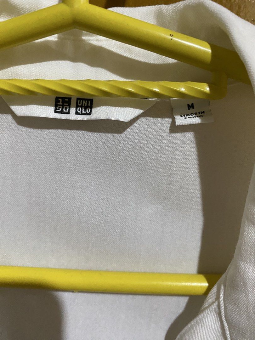 Uniqlo White V-Neck Blouse Size M (Category: Blouses) located in Antipolo. Submitted by jl_2025 (Listing ID 1464874982, Image 2). Description: - Brand: Uniqlo - Item: White V-neck blouse - Size: M (tag attached) - Fit: Relaxed fit with long sleeves and button cuffs - Fabric: Lightweight and comfortable - Condition: Brand new with tag, clean, no stains or damage Rfs: moving out .