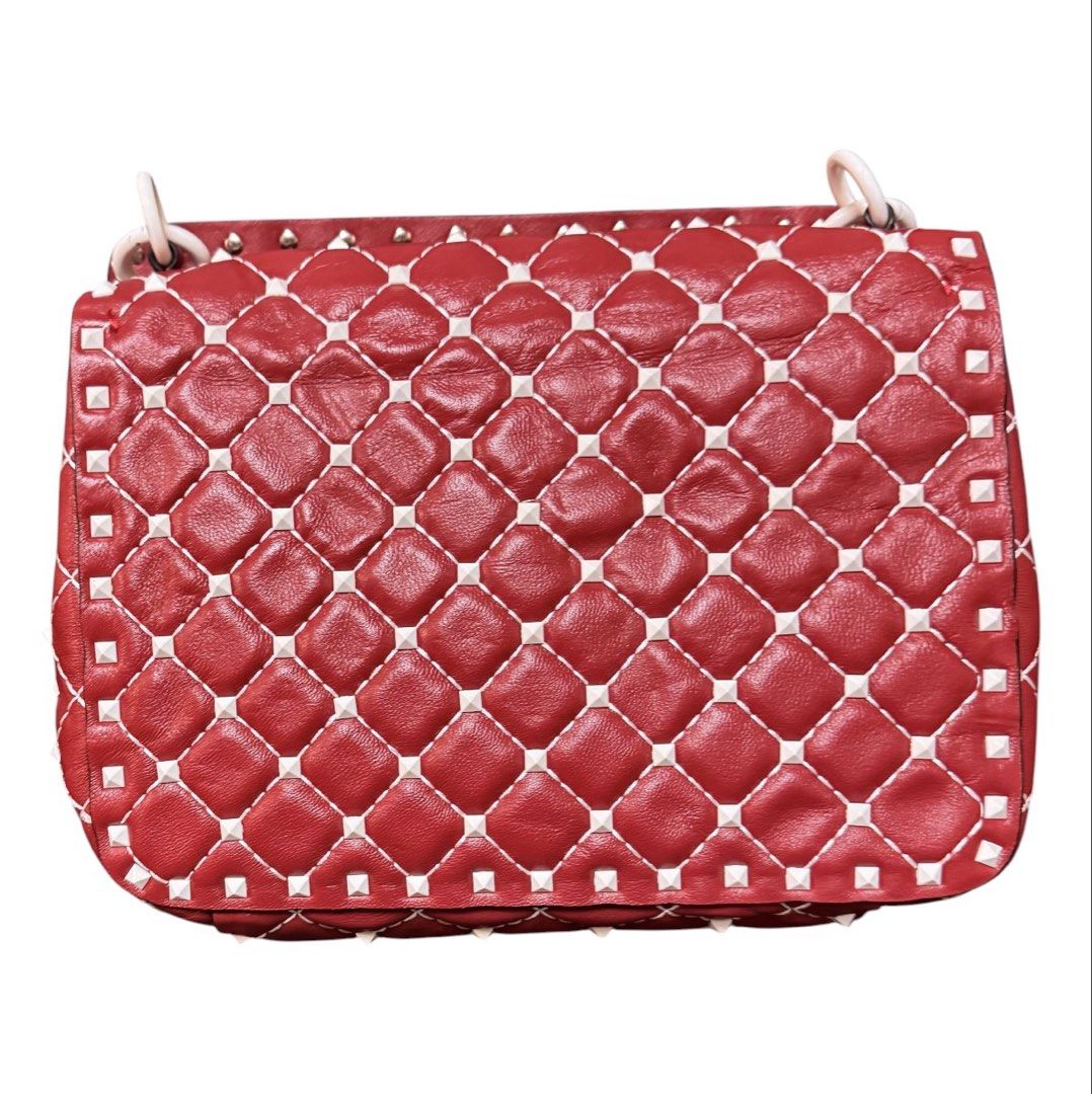 Valentino Studded Hand Bag (Category: Tote Bags) located in Baguio. Submitted by pwz-eshop (Listing ID 1464826059, Image 3). Description: • Please take time to read. • I do not have when worn pictures, please rely on actual dimensions for sizing. • Up for Grabs!! • Flaws: Missing sling. Press marks underneath the flap. (please see photos) • BRAND: Vale entino. • DIMENSIONS: length 9.25", height 7", width 2.75", handle drop: 3.5". • SERIAL NUMBER: