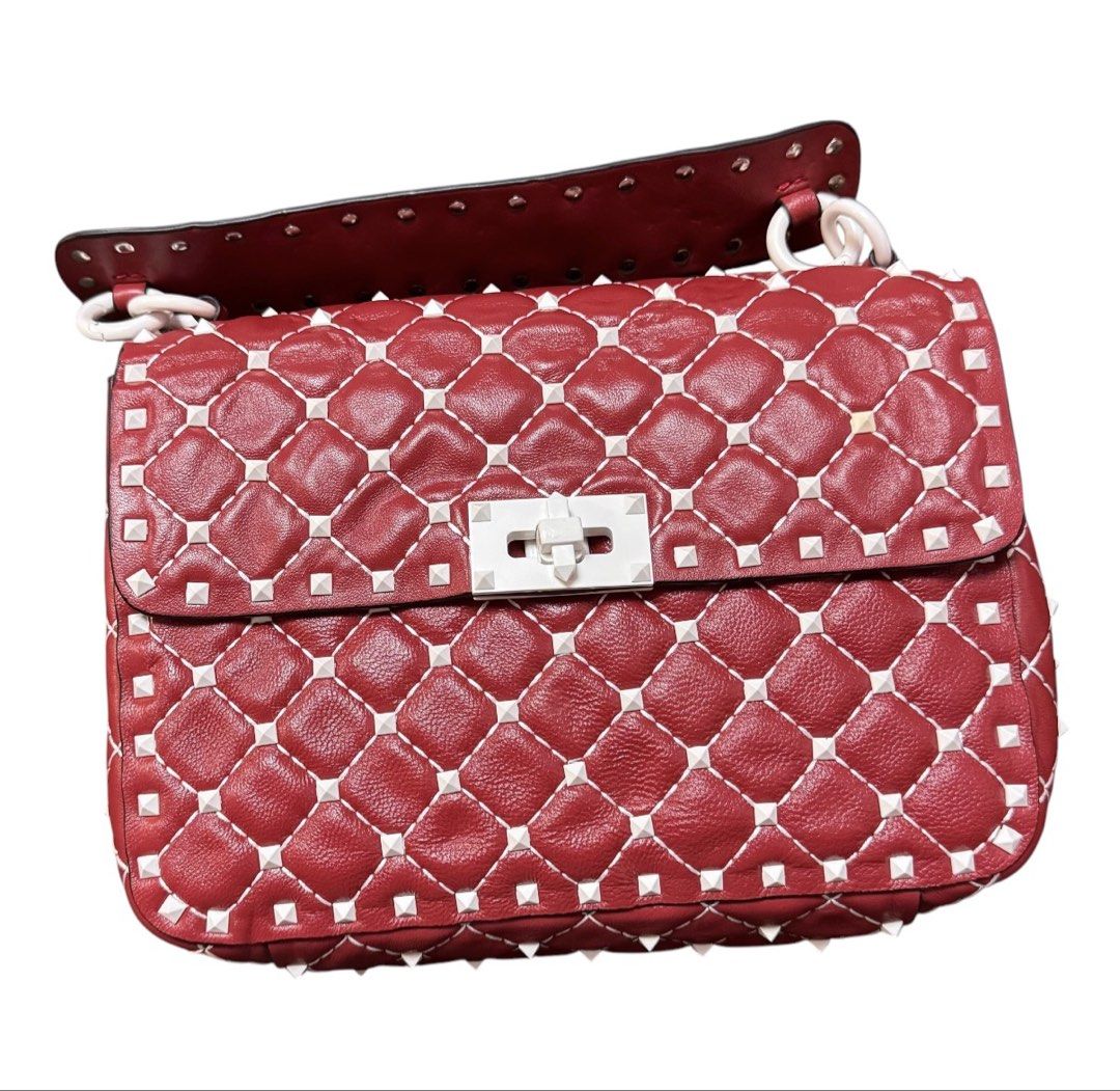 Valentino Studded Hand Bag (Category: Tote Bags) located in Baguio. Submitted by pwz-eshop (Listing ID 1464826059, Image 2). Description: • Please take time to read. • I do not have when worn pictures, please rely on actual dimensions for sizing. • Up for Grabs!! • Flaws: Missing sling. Press marks underneath the flap. (please see photos) • BRAND: Vale entino. • DIMENSIONS: length 9.25", height 7", width 2.75", handle drop: 3.5". • SERIAL NUMBER: