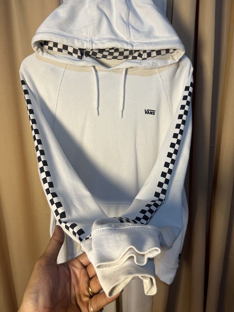 Vans Checkerboard Hoodie White Size Medium (Category: Hoodies) located in Kidapawan. Submitted by azythrift (Listing ID 1464914727, Image 3). Description: - Authentic White Vans hoodie - Size: Medium (based on inner neck tag) - Iconic black and white checkerboard print on sleeves and hood lining - Small black embroidered Vans logo on the left chest - Cozy fleece interior for maximum comfort - Features a front kangaroo pocket and drawstring hood -