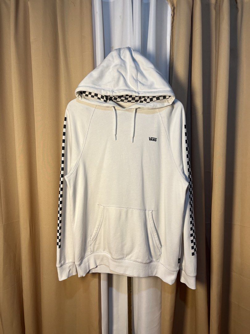 Vans Checkerboard Hoodie White Size Medium (Category: Hoodies) located in Kidapawan. Submitted by azythrift (Listing ID 1464914727, Image 1). Description: - Authentic White Vans hoodie - Size: Medium (based on inner neck tag) - Iconic black and white checkerboard print on sleeves and hood lining - Small black embroidered Vans logo on the left chest - Cozy fleece interior for maximum comfort - Features a front kangaroo pocket and drawstring hood -