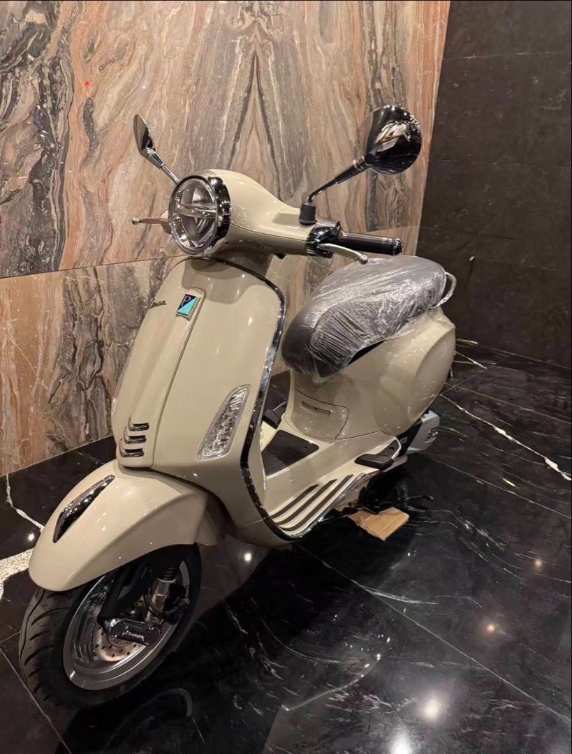 Vespa Primavera Beige Scooter (Category: Skates, Rollerblades & Scooters) located in Manila. Submitted by dandzcamacho81 (Listing ID 1464922323, Image 2). Description: - Model: Vespa Primavera - Color: Glossy beige - Condition: Brand new look, seat still wrapped in factory plastic, clean body and pristine chrome - Features: Digital dashboard display, chrome mirrors, rear grab rail - Registration: Includes temporary dealer registration plate from 