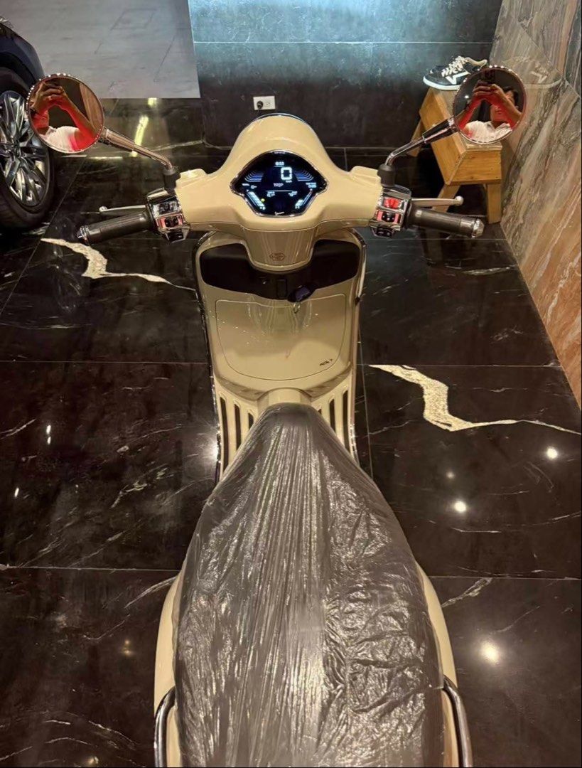 Vespa Primavera Beige Scooter (Category: Skates, Rollerblades & Scooters) located in Manila. Submitted by dandzcamacho81 (Listing ID 1464922323, Image 3). Description: - Model: Vespa Primavera - Color: Glossy beige - Condition: Brand new look, seat still wrapped in factory plastic, clean body and pristine chrome - Features: Digital dashboard display, chrome mirrors, rear grab rail - Registration: Includes temporary dealer registration plate from 