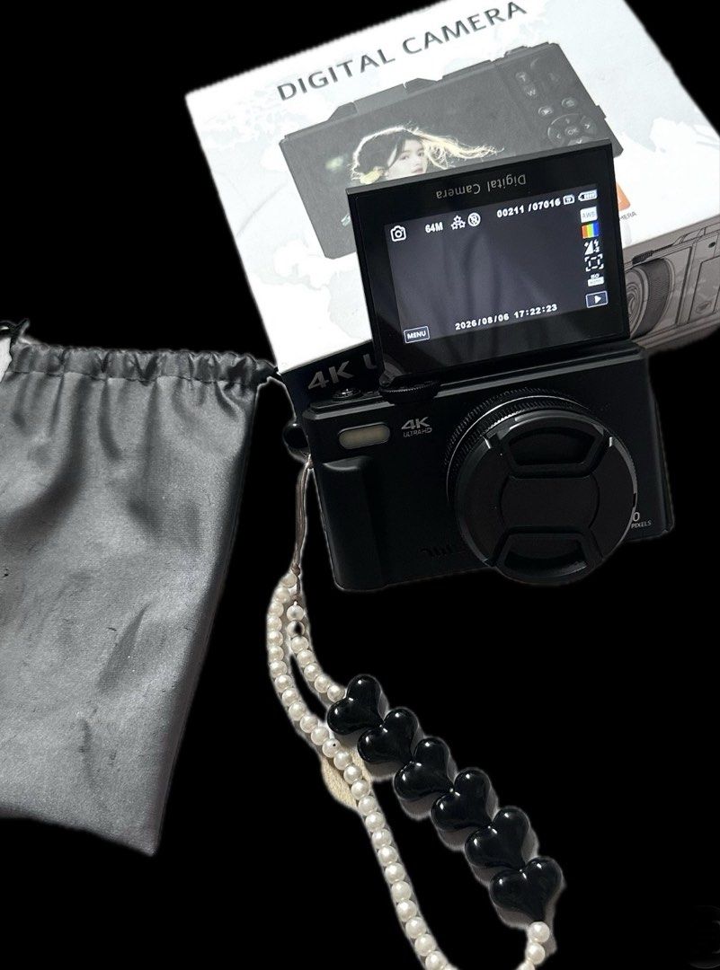 Vetek 8 Digital Camera Pro (Category: Cameras) located in Manila. Submitted by jichuness (Listing ID 1464790976, Image 2). Description: - Color: Sleek Black - Resolution: Up to 64M photos, 4K video - Features: Flip-up screen, 18x digital zoom, great for vlogs - Inclusions: Beaded wrist strap with black heart charms, grey drawstring pouch, original box, and lens cap - Condition: Brand new in box, easy to use 📍sampaloc manila.