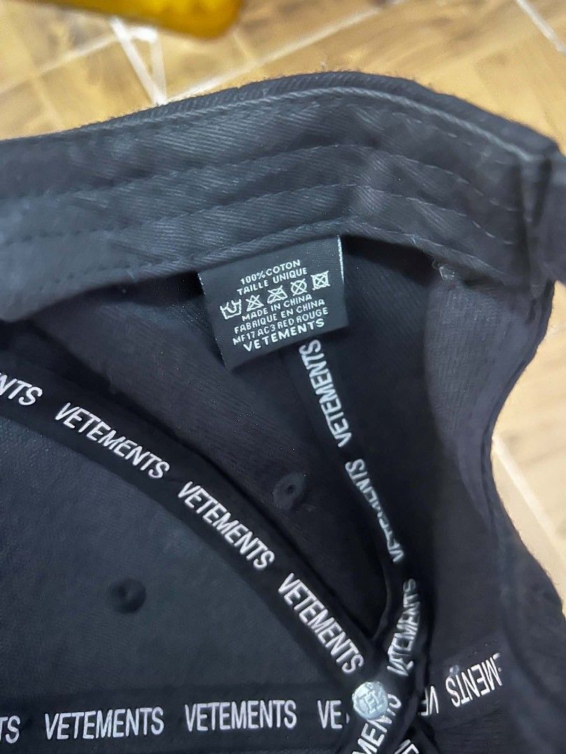 Vetemets Securite Black Cap (Category: Caps & Hats) located in Manila. Submitted by olimpusibl32089 (Listing ID 1464916960, Image 2). Description: - Brand: Vetements - Style: Securite Embroidered Cap - Color: Black with white embroidery - Material: 100% Cotton - Size: Unique / One Size - Condition: Light wear from regular use, well-maintained - Details: Branded interior tape, made in China.