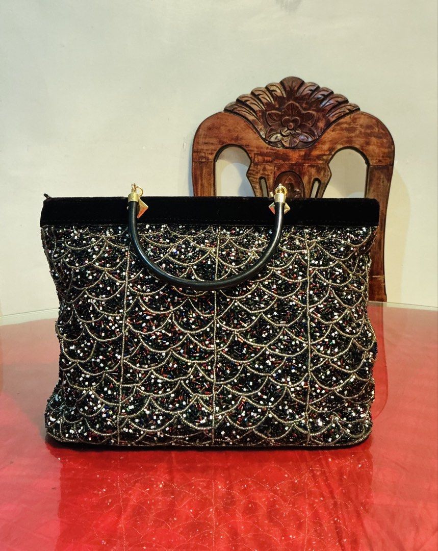 Vintage Beaded Handbag (Category: Purses & Pouches) located in Manila. Submitted by harpymonetttt (Listing ID 1464809595, Image 1). Description: - Elegant black handbag with intricate beaded pattern - Chic round top handle accented with stylish gold hardware - Secure zipper top closure to keep your essentials safe - Spacious interior with plenty of room for your party must-haves - Perfect statement accessory for dinners, parties, and formal event