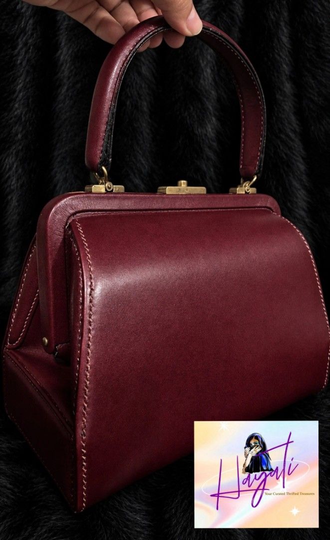 Vintage Burgundy Frame Bag (Category: Luxury Bags & Wallets) located in Angono. Submitted by just.call.me_lazy (Listing ID 1464946679, Image 1). Description: Vintage Burgundy Frame Bag 🍷✨ A timeless vintage beauty in a rich burgundy shade. Features a classic kisslock frame closure, structured silhouette, and beautifully preserved leather that still looks amazing despite its age. Elegant, feminine, and effortlessly chic. The kind of piece that el