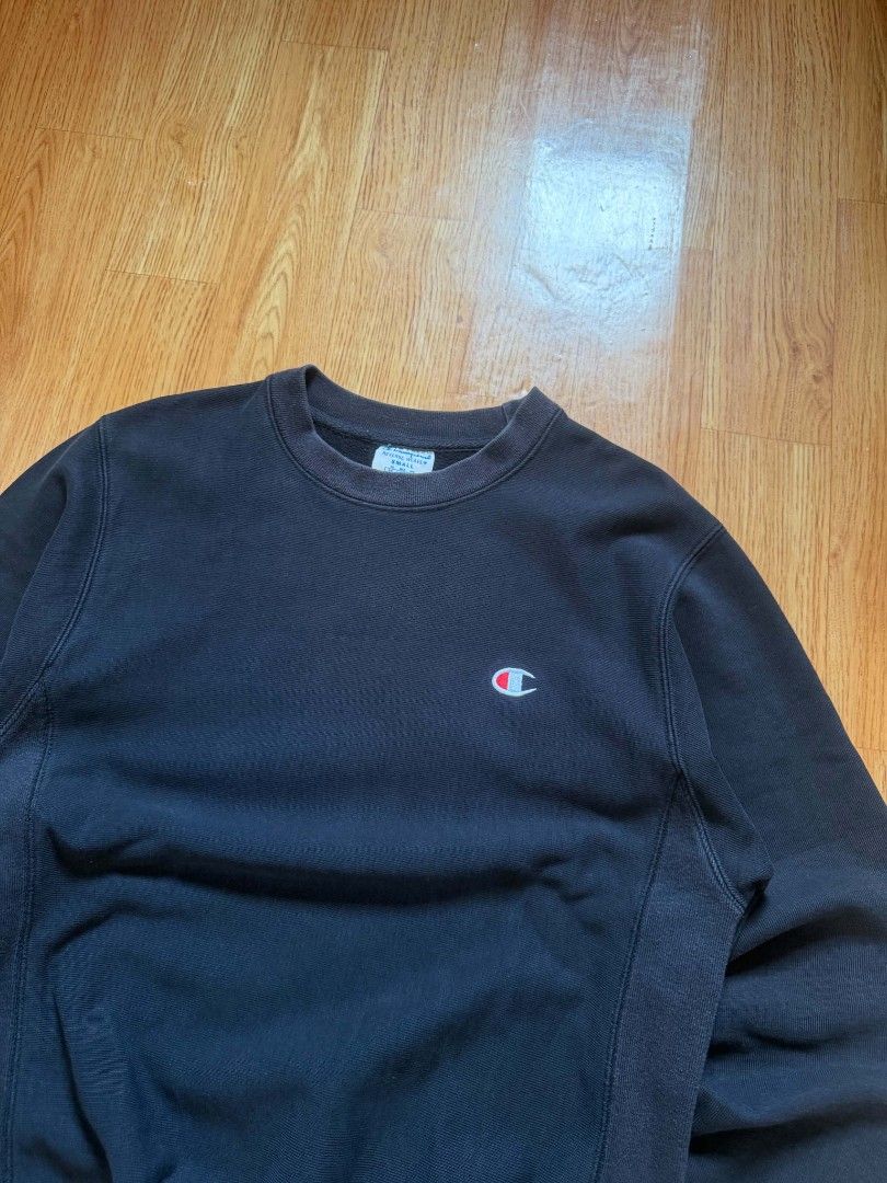 Vintage Champion Reverse Weave Big Script Logo Sweatshirt Black (Category: Coats, Jackets and Outerwear) located in Angeles City. Submitted by repurposedwear (Listing ID 1464879287, Image 3). Description: Authentic black Champion Reverse Weave sweatshirt in size S. Features the classic embroidered C logo and a bold white-and-red script logo wrapped around the back and sleeve. Made with heavyweight cotton and ribbed side gussets. Excellent, clean 