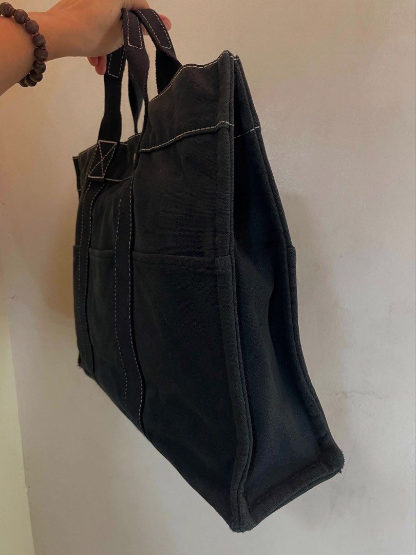 Vintage Hermès Canvas Tote (Category: Luxury Bags & Wallets) located in Manila. Submitted by thevintagebow (Listing ID 1464967383, Image 3). Description: Quiet luxury on a budget? Say less.✨ This vintage Hermès Fourre-Tout MM in black canvas is a proof that simplicity never goes out of style. The crisp white stitching gives it that clean, elevated look, while the durable canvas and roomy design mean you can carry your life in it effortlessly! Pri