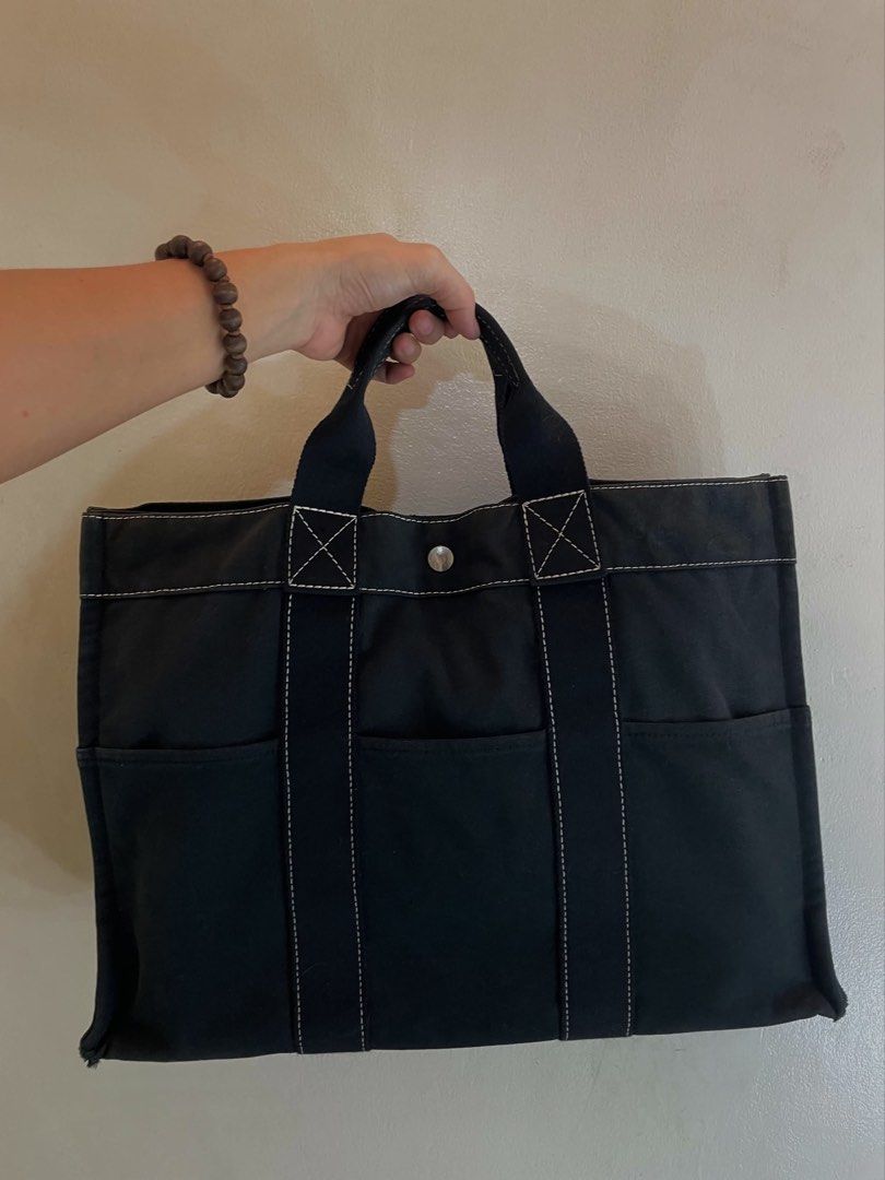 Vintage Hermès Canvas Tote (Category: Luxury Bags & Wallets) located in Manila. Submitted by thevintagebow (Listing ID 1464967383, Image 1). Description: Quiet luxury on a budget? Say less.✨ This vintage Hermès Fourre-Tout MM in black canvas is a proof that simplicity never goes out of style. The crisp white stitching gives it that clean, elevated look, while the durable canvas and roomy design mean you can carry your life in it effortlessly! Pri