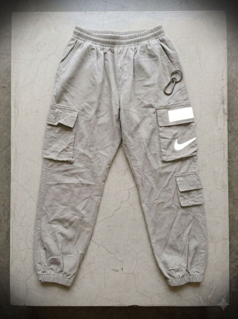 Vintage Nike Red Tag Cargo Pants (Category: Jeans) located in Manila. Submitted by liliaplay (Listing ID 1464797127, Image 1). Description: Authentic! Pre-loved Imported 7 pockets solid print designs reflectorized patch design strap pockets semi heavy and thick Unisex for teenagers or small adults 4flat below size: 24-26 hem/rise: 10.5 length: 32.5 No Issue! need wash Lowered to its negotiable price Payment 1st Shipped.