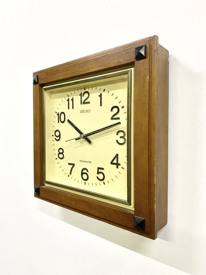 Vintage Seiko Transistor Wood Wall Clock (Category: Clocks) located in Santa Rosa. Submitted by annie_annie83 (Listing ID 1464873853, Image 2). Description: - Vintage Seiko Transistor wall clock - Classic wooden frame with stylish black pyramid corner accents - Off-white square dial with black Arabic numerals and gold-toned bezel - Clean and fully working mechanism - Battery-operated (takes standard batteries) - Condition: Minor wear along the wo