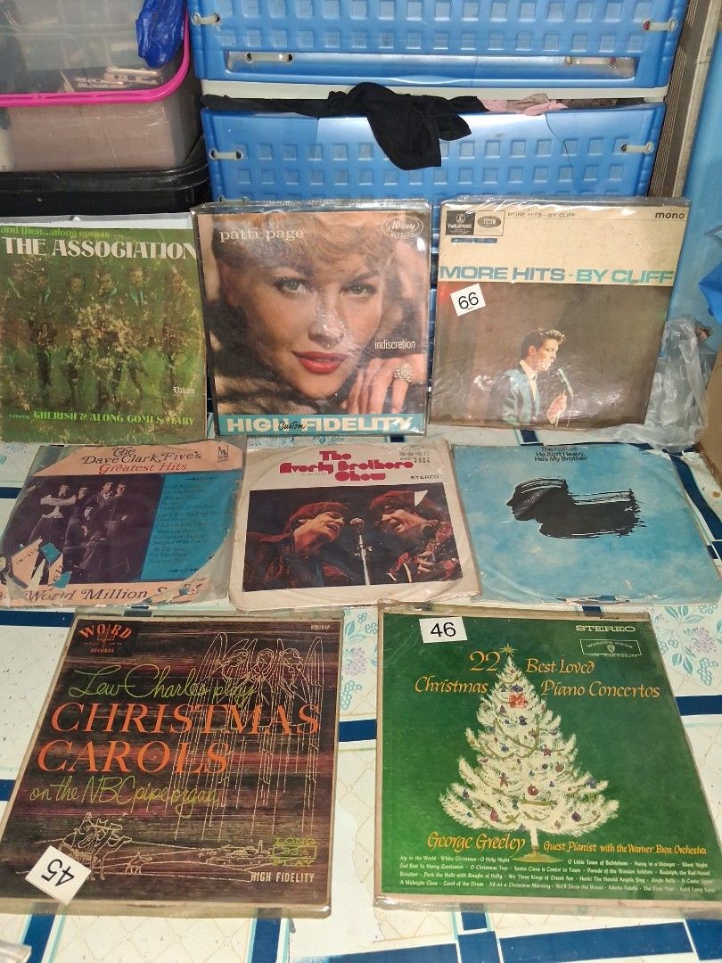 Vintage Vinyl Record LP Collection Various Artists (Category: Vinyls) located in Manila. Submitted by marcas022798212 (Listing ID 1464780418, Image 1). Description: - Bundle of vintage vinyl records including 60s pop and Christmas classics - Featured artists: The Association, Cliff Richard, Patti Page, and Dave Clark Five - Condition note: Covers have heavy wear, edge fraying, tears, and aging marks - Includes plastic outer sleeves on several ite
