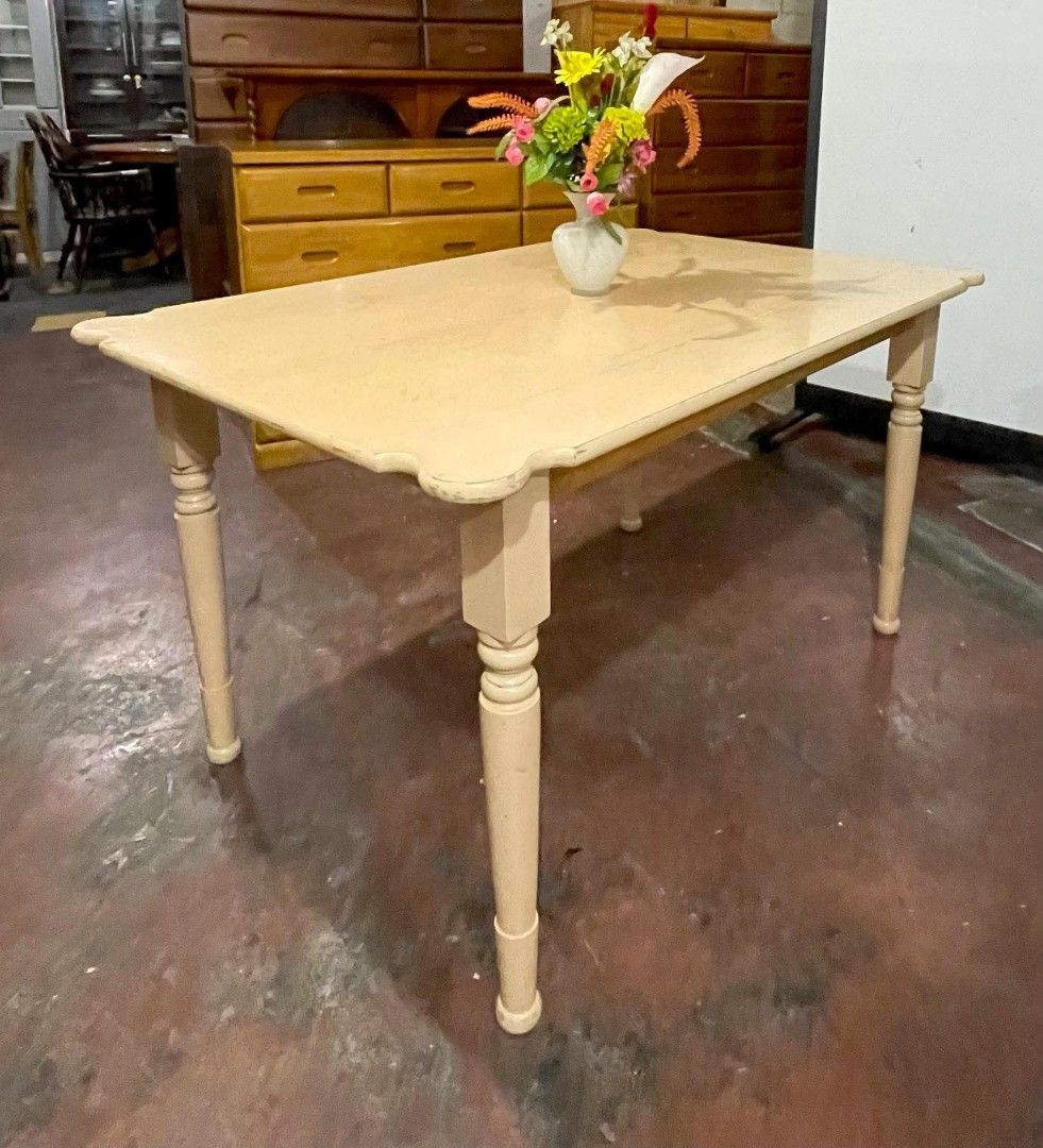 Vintage Wooden Dining Table (Category: Tables & Sets) located in Quezon City. Submitted by dannikkishoppe2 (Listing ID 1464879277, Image 3). Description: Vintage Wooden Dining Table ‼️₱5000‼️ • Cream-painted wooden dining table featuring classic turned legs and elegant scalloped corner edges • Dimensions: L51 W33.5 H28.5 inches • Solid, sturdy build ensuring long-lasting durability • Condition: Minor surface wear on the tabletop, still looks love