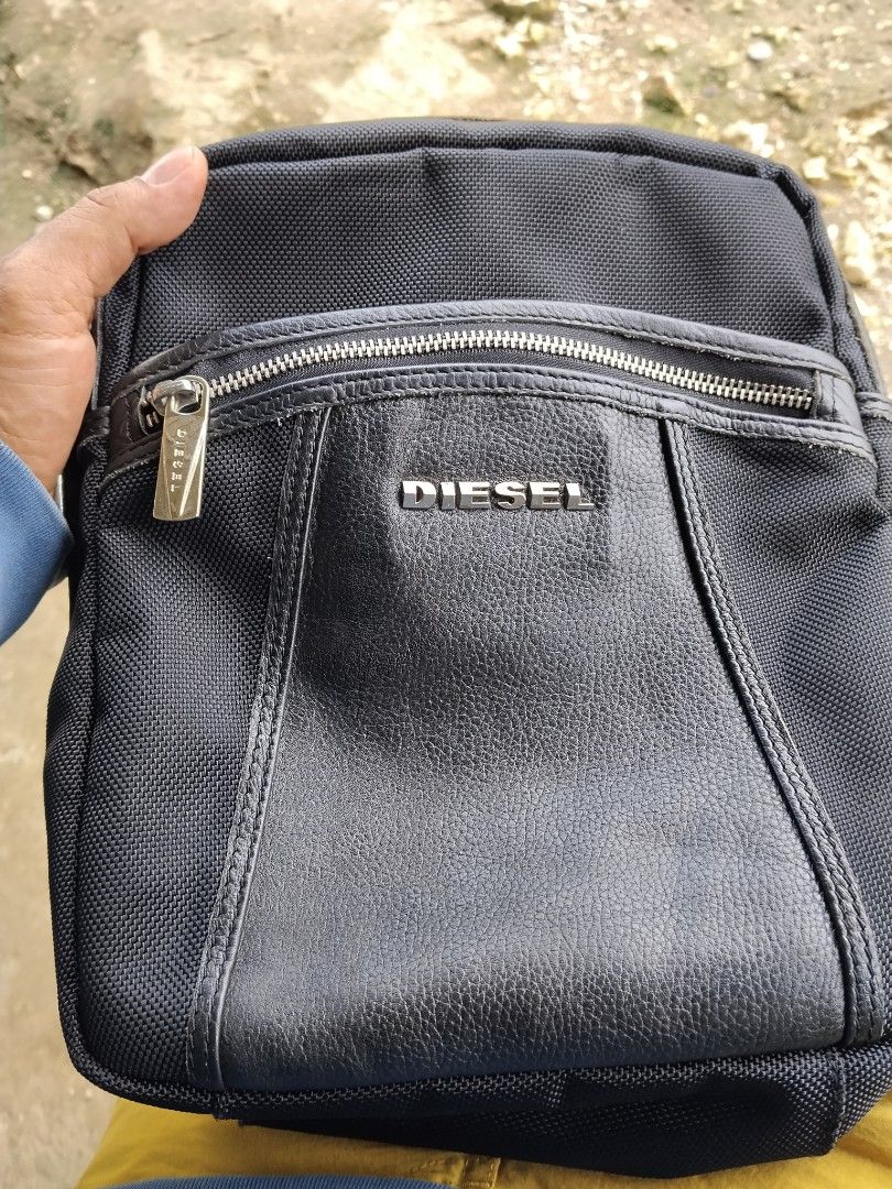 Vintage Y2k Diesel adjustable sling bag Canada release (Category: Luxury Bags & Wallets) located in Talacogon. Submitted by clsthrifty (Listing ID 1464888429, Image 2). Description: Excellent condition Leather and nylon Material Hardware metal puller zipper Coded zipper No issue.