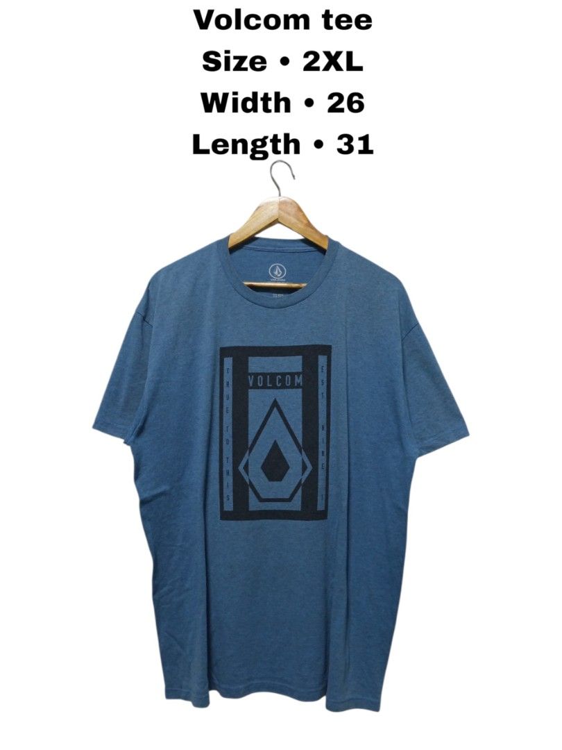 Volcom Blue Graphic Tee Size 2XL (Category: Tshirts & Polo Shirts ) located in Magdalena. Submitted by magdalenathrift20 (Listing ID 1464911067, Image 1). Description: - Brand: Volcom - Size: 2XL (26" chest width, 31" length) - Design: Blue heather with large chest graphic print, crew neck, short sleeves - Material: Comfortable standard cotton blend - Condition: Great for casual everyday wear.