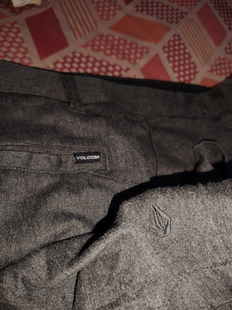 Volcom dark Gray Shorts Size 33 (Category: Shorts) located in Roxas, Palawan. Submitted by act_thrift_palawan (Listing ID 1464868242, Image 2). Description: - Brand: Volcom - Size: 33 - Color: Charcoal marled gray - Closure: Classic button with embossed logo - Pockets: Rear welt pockets with branded tag - Details: Embroidered stone logo near hem, black interior waistband lining - Condition: Clean and well-maintained - Mode of Payment: GCash or BP