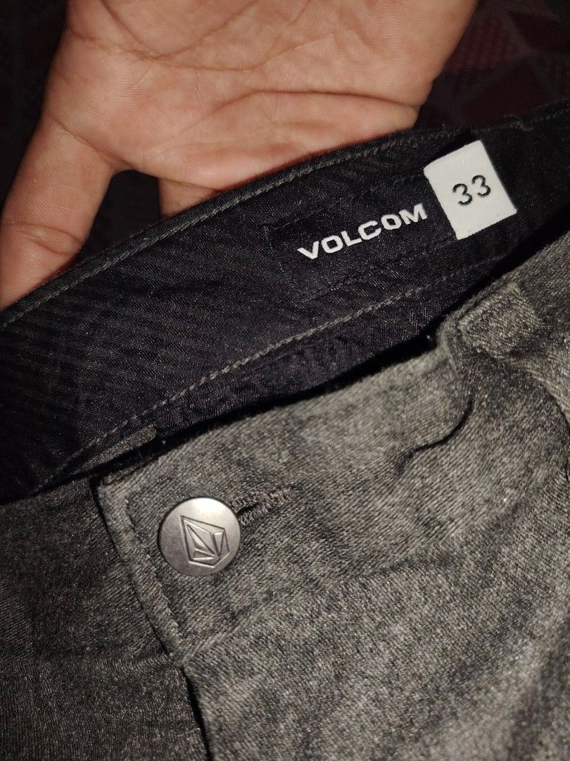 Volcom dark Gray Shorts Size 33 (Category: Shorts) located in Roxas, Palawan. Submitted by act_thrift_palawan (Listing ID 1464868242, Image 3). Description: - Brand: Volcom - Size: 33 - Color: Charcoal marled gray - Closure: Classic button with embossed logo - Pockets: Rear welt pockets with branded tag - Details: Embroidered stone logo near hem, black interior waistband lining - Condition: Clean and well-maintained - Mode of Payment: GCash or BP