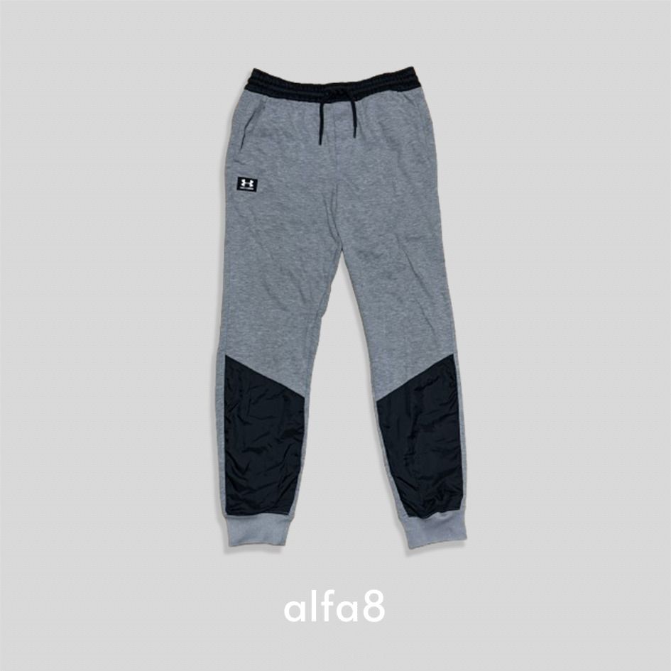(W:30) Authentic Under Armour Joggers Grey Black Sweatpants (Category: Other Bottoms) located in Imus. Submitted by alfa_8 (Listing ID 1464856865, Image 3). Description: Gorpcore / Sporty / Streetwear / Athleisure Condition: 9/10 (Great pre-loved condition, please manage expectations) Color: Heather Grey body accented with a solid black waistband and matching black knee-to-calf panels. Authentic Under Armour joggers featuring a comfortable tapere