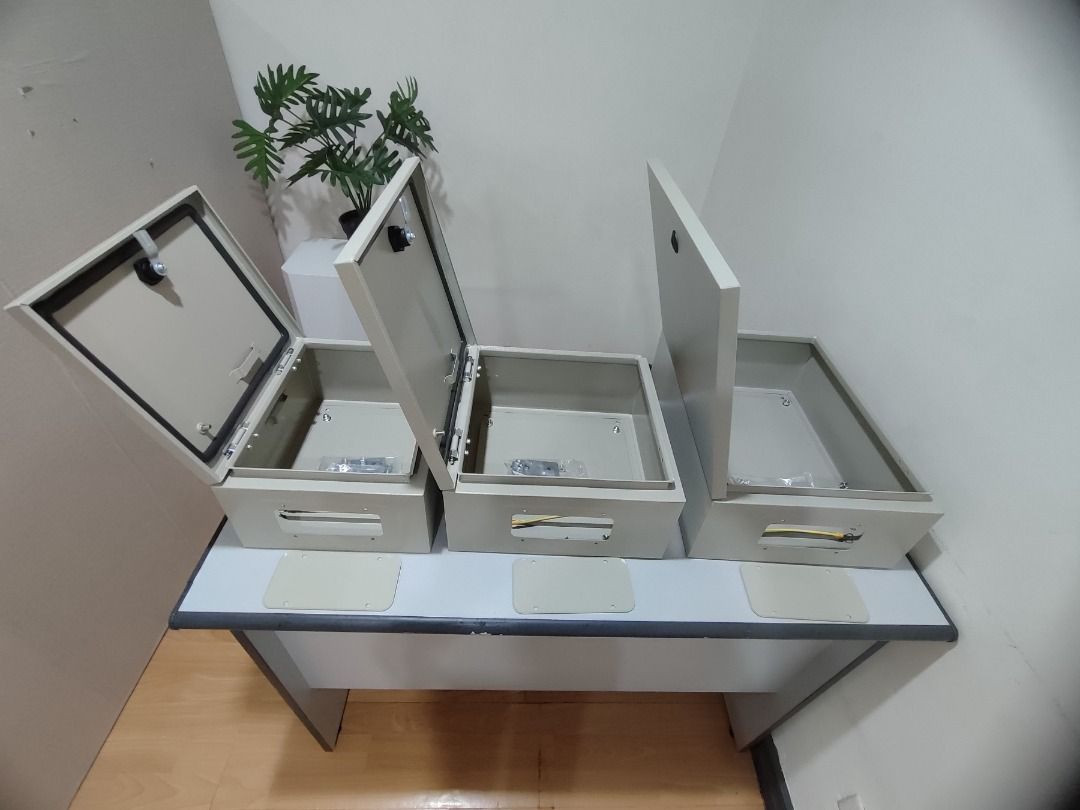 Wall Mounting Metal Enclosure (Category: Construction & Building Materials) located in Manila. Submitted by cyrenejoye (Listing ID 1464810851, Image 2). Description: - Brand new metal enclosure box in original packaging - Durable beige finish with a solid, heavy-duty build - Hinged door equipped with a secure locking latch and weather-resistant rubber seal - Includes internal mounting plate and complete hardware bag - Ideal for secure electrical 