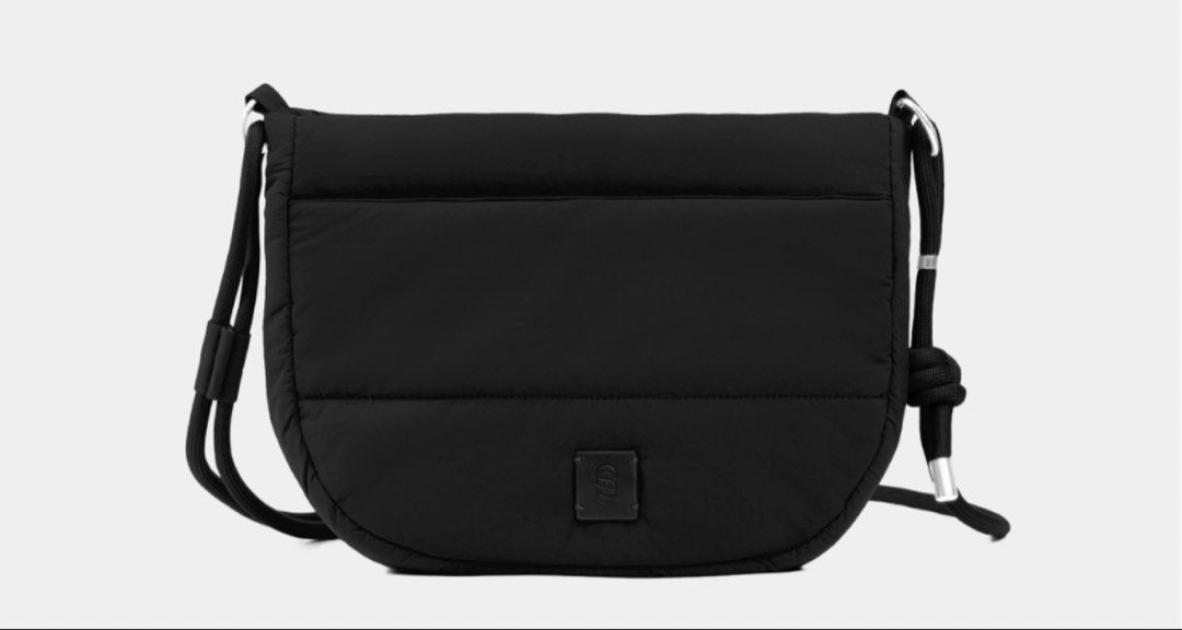 Wanda sling Puffed Crossbody Bag (Category: Cross-body Bags) located in Cavite. Submitted by nikkatsu (Listing ID 1464838097, Image 2). Description: - Trendy puffed nylon crossbody bag available in brown and black - Secure flap closure with clean tonal stitching and a square branded logo patch - Comfortable, adjustable rope strap accented with chic metal hardware - Ultra-lightweight and minimalist silhouette - Ideal everyday bag for your daily es