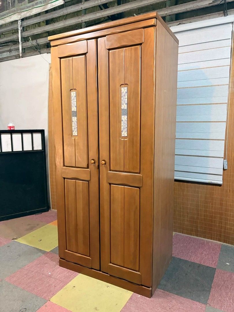 Wardrobe (Category: Shelves, Cabinets & Racks) located in Meycauayan. Submitted by marygracecasimiro (Listing ID 1464829164, Image 3). Description: Mid-Century 2-Door Closet / Wardrobe Cabinet Solid Wood Doors, MAKINIS!!! This is a classic 2-door wooden wardrobe cabinet with tiled ilay design & a built-in hanging rod and partitioned shelving compartments. Price : 12,900 ✅ *SEE VIDEO COMMENT 35L x 23W x 77H inches In VERY good condition ♥️.