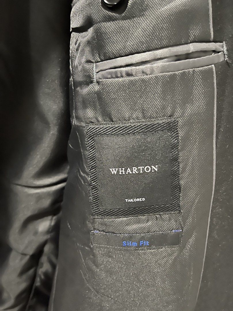 WHARTON |Two Button Suit Jacket | Black | Size 54 (Category: Coats, Jackets and Outerwear) located in Taguig. Submitted by shennelaluuh (Listing ID 1464835396, Image 2). Description: - Brand/Style: Wharton slim-fit blazer in solid black - Size: 54 - Material: 80% polyester, 20% rayon (polyester lining) - Closure: Two-button front - Pockets: Chest pocket and hip flap pockets - Cuffs: Three buttons on each cuff - Care: Dry clean only.