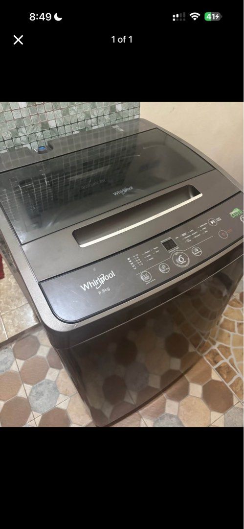 Whirlpool 8.8kg Top Load Washing Machine (Category: Washing Machines and Dryers) located in Bulacan. Submitted by zealeagle_33f4cd (Listing ID 1464891889, Image 1). Description: Whirlpool top load washing machine with an 8.8kg capacity. Dark grey finish with a clear glass lid. Digital control panel right on top with 6th Sense technology and energy saver modes. Detergent box built into the lid area. Clean exterior, works well for daily laundry loa